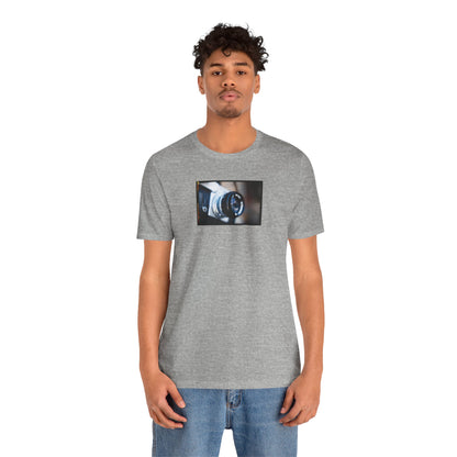 "Camera in an Athens Flea Market" Unisex Jersey Short Sleeve Tee